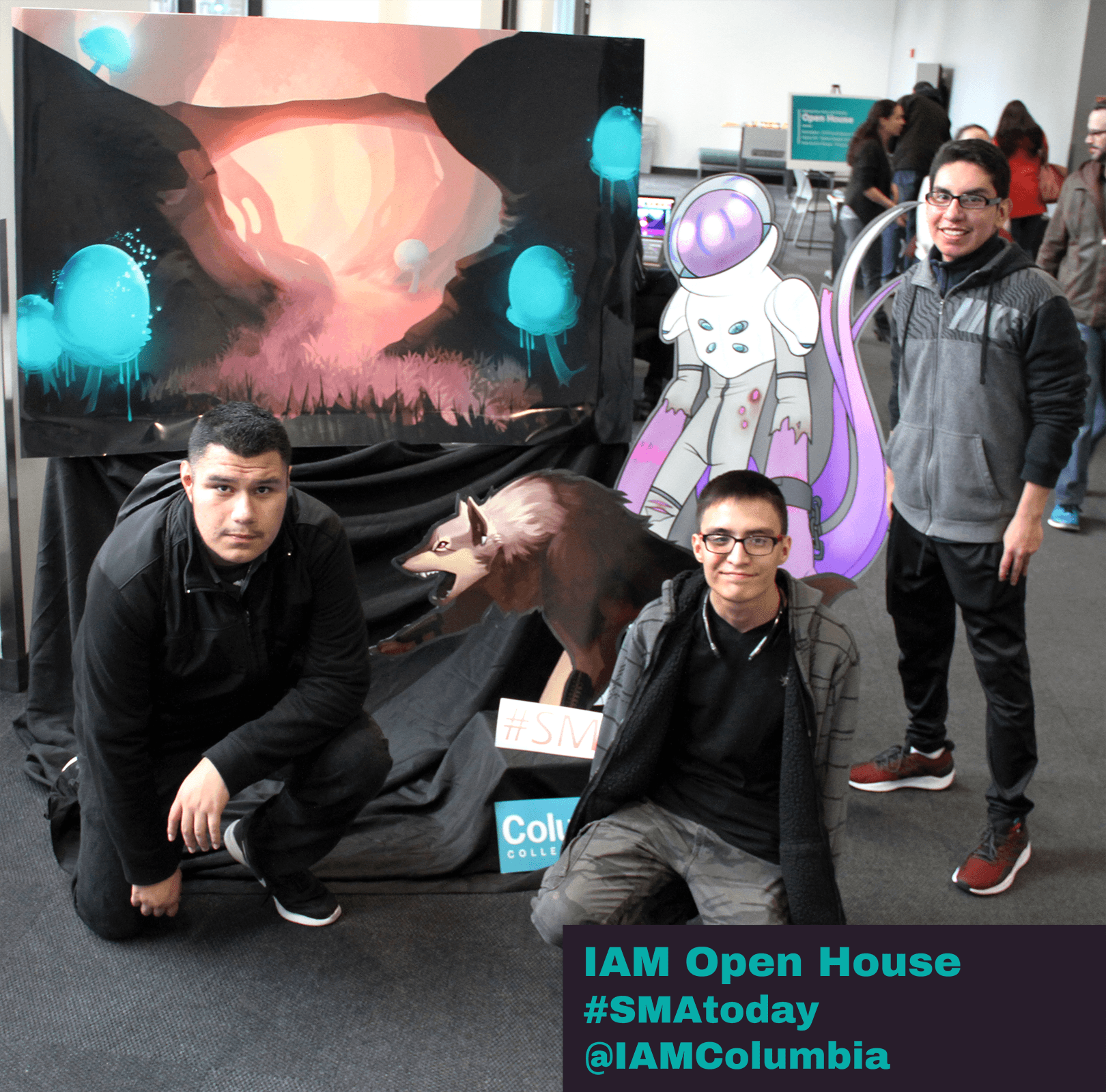 Guests at IAM's open house event 2018 photographed in front of student work