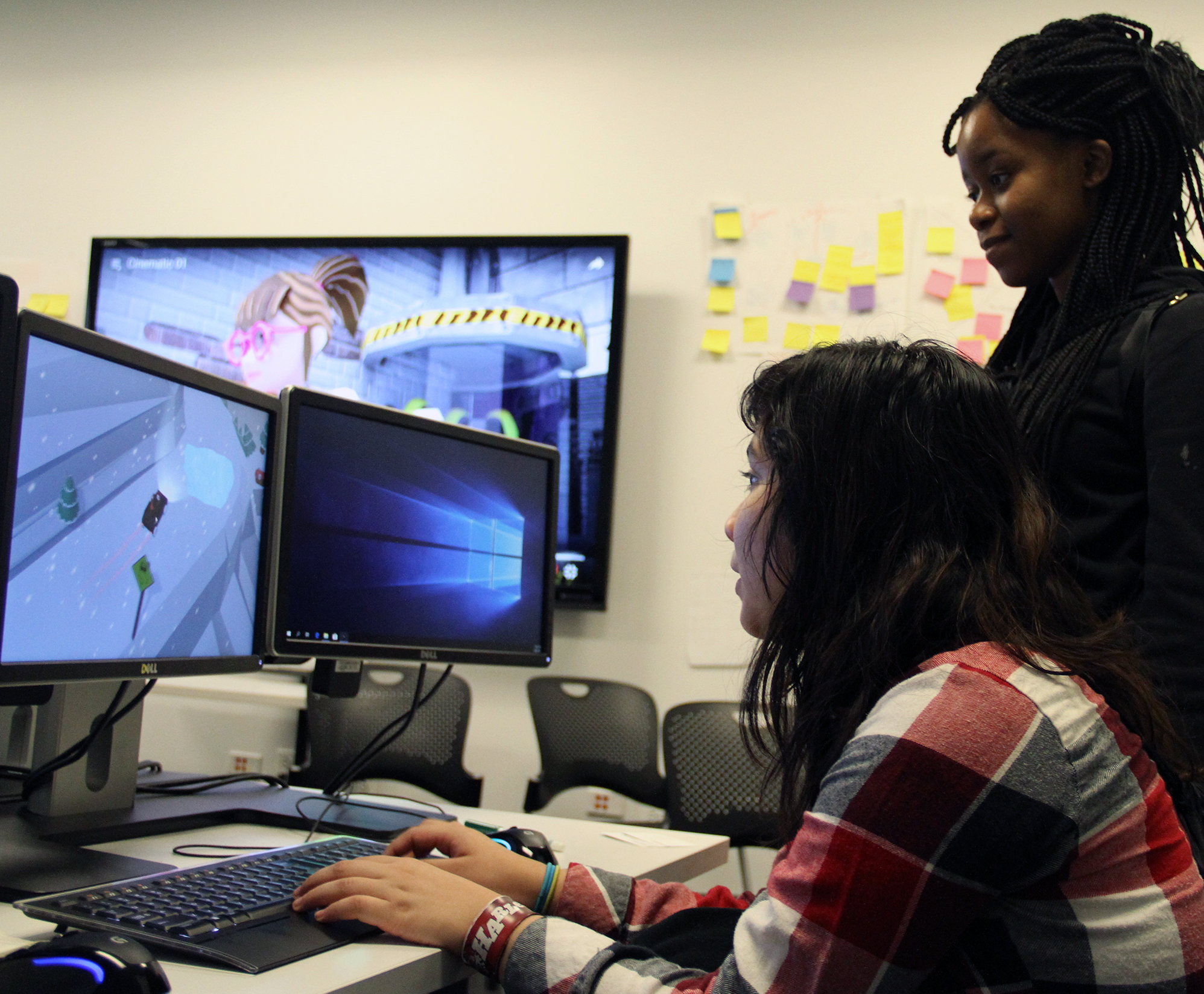 Guests playing a student-developed game at IAM's open house